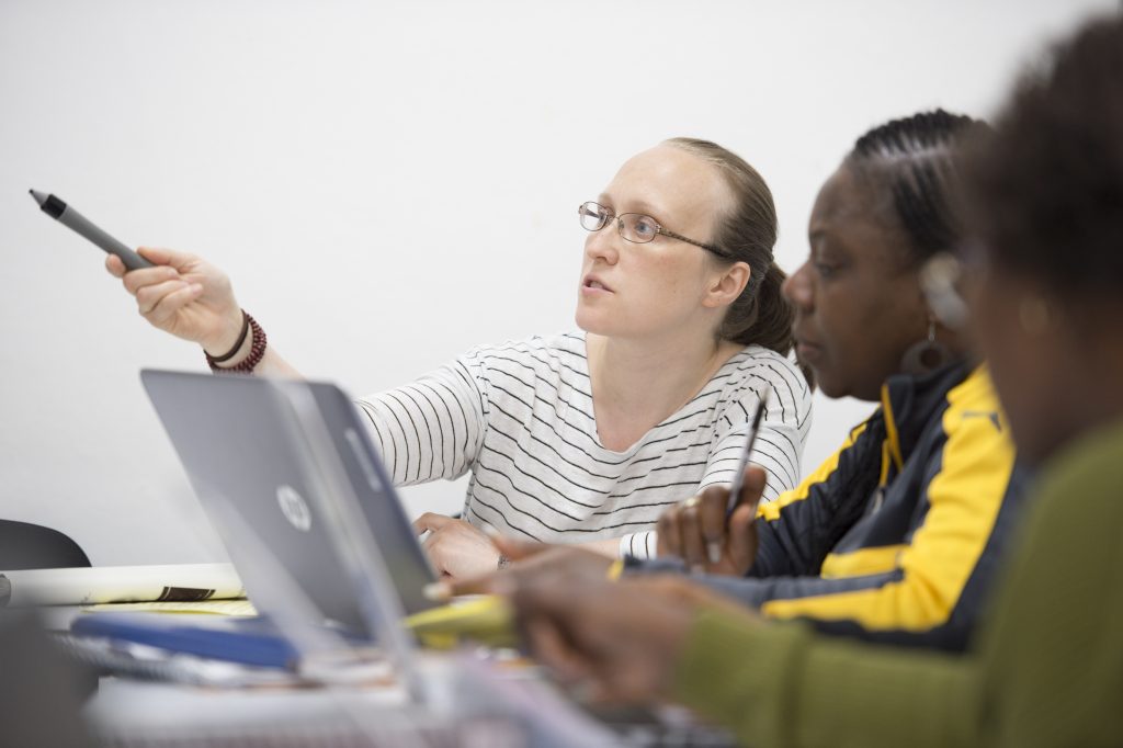 Students with a teacher in a classroom