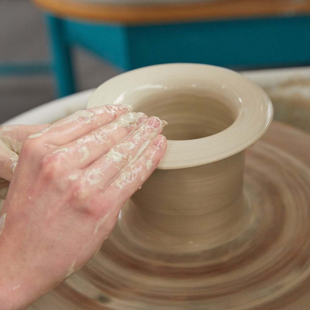 A student working on pottery