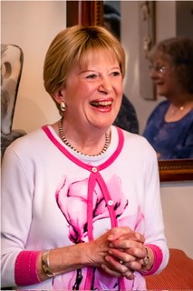 lady in pink laughing