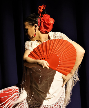 Image of dance tutor Fenella Juanita Barker performing a flamenco dance