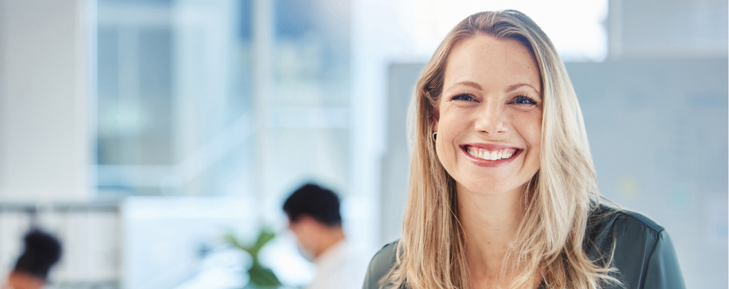 Lady smiling in corporate office setting
