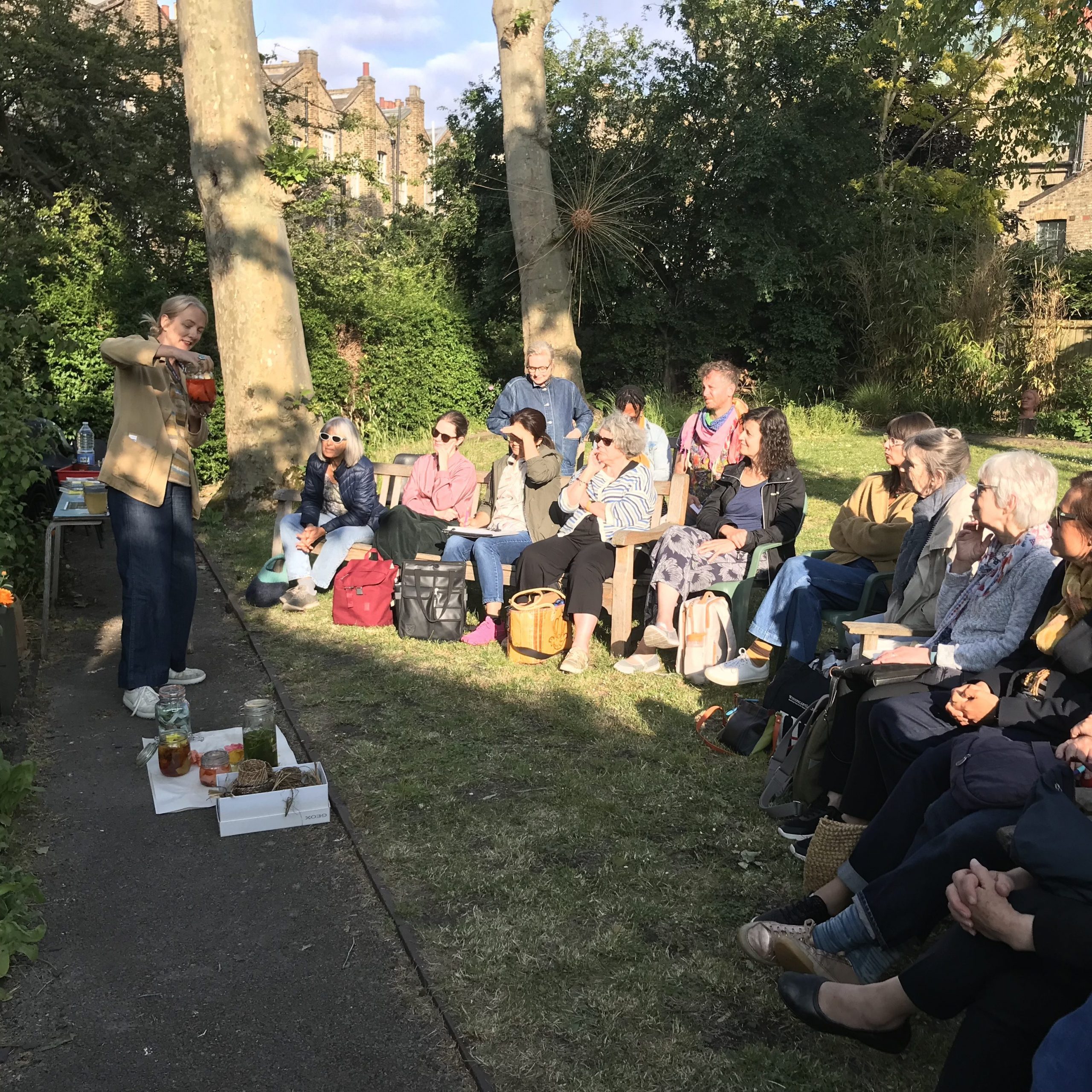 People sitting in Morley College's dye garden