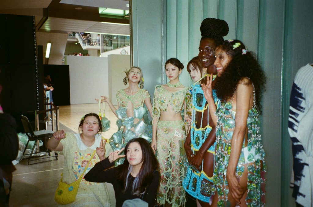 women standing in group smiling